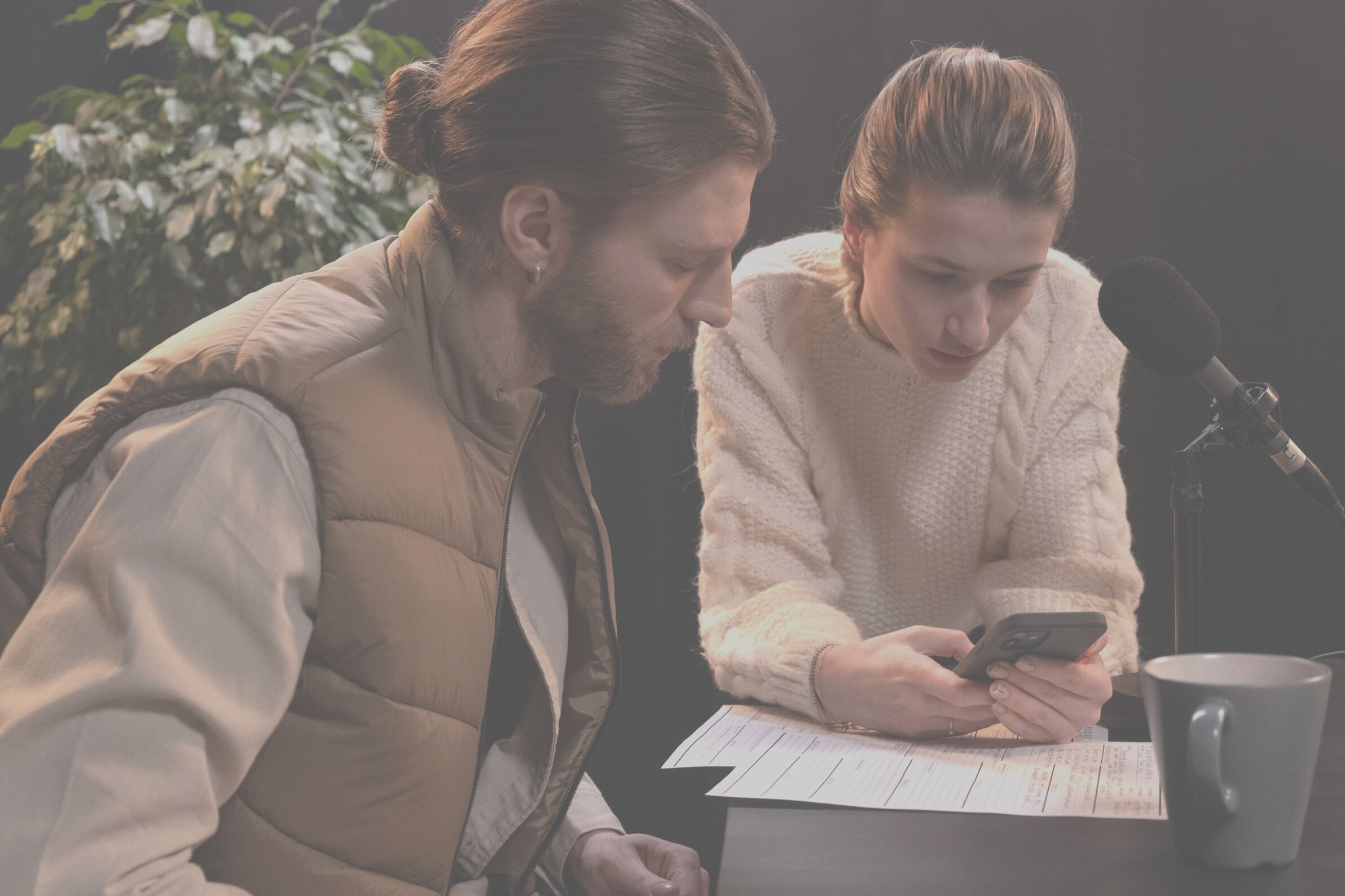 A Woman and Man Looking to the Smartphone Together